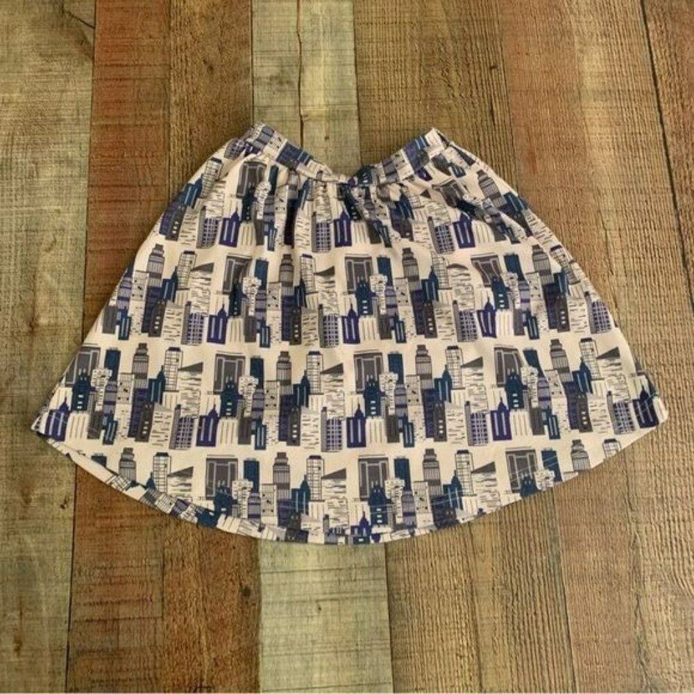 Penny candy girls skirt with city buildings in white and blue